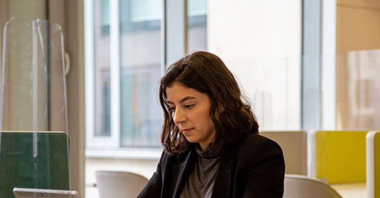 What is a dedicated desk in a coworking space?